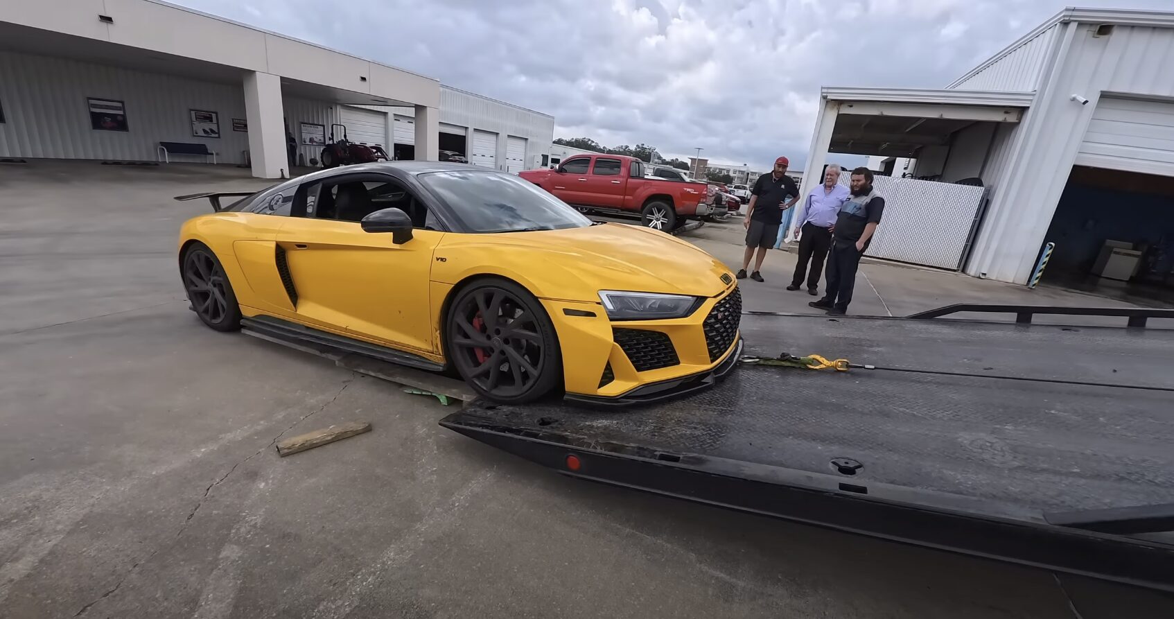Professional Flatbed Towing Service in Gilroy Flatbed tow truck safely transporting luxury sports car