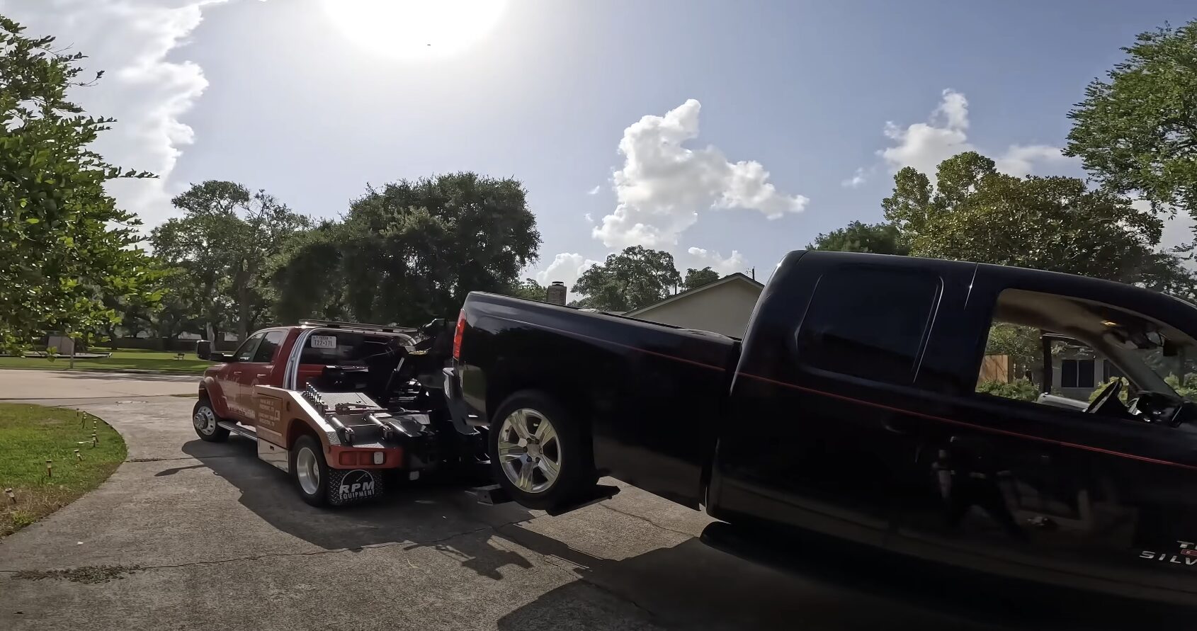 Professional Roadside Assistance and Recovery Services Professional towing and recovery operation on rural roadway